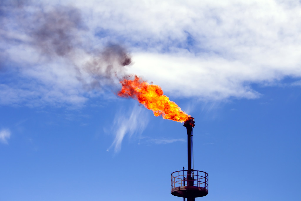 Gas flame torch on a oil refinery plant. Oil indutry. Gas refinery plant